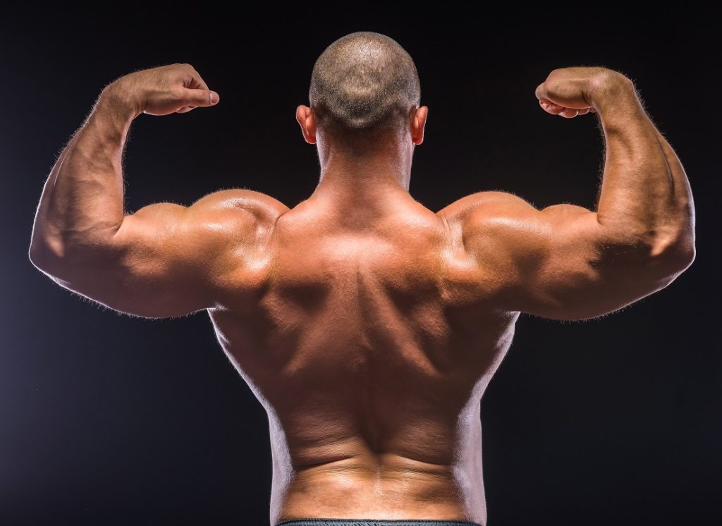 man showing off strong forearms to demonstrate most neglected muscles in the gym